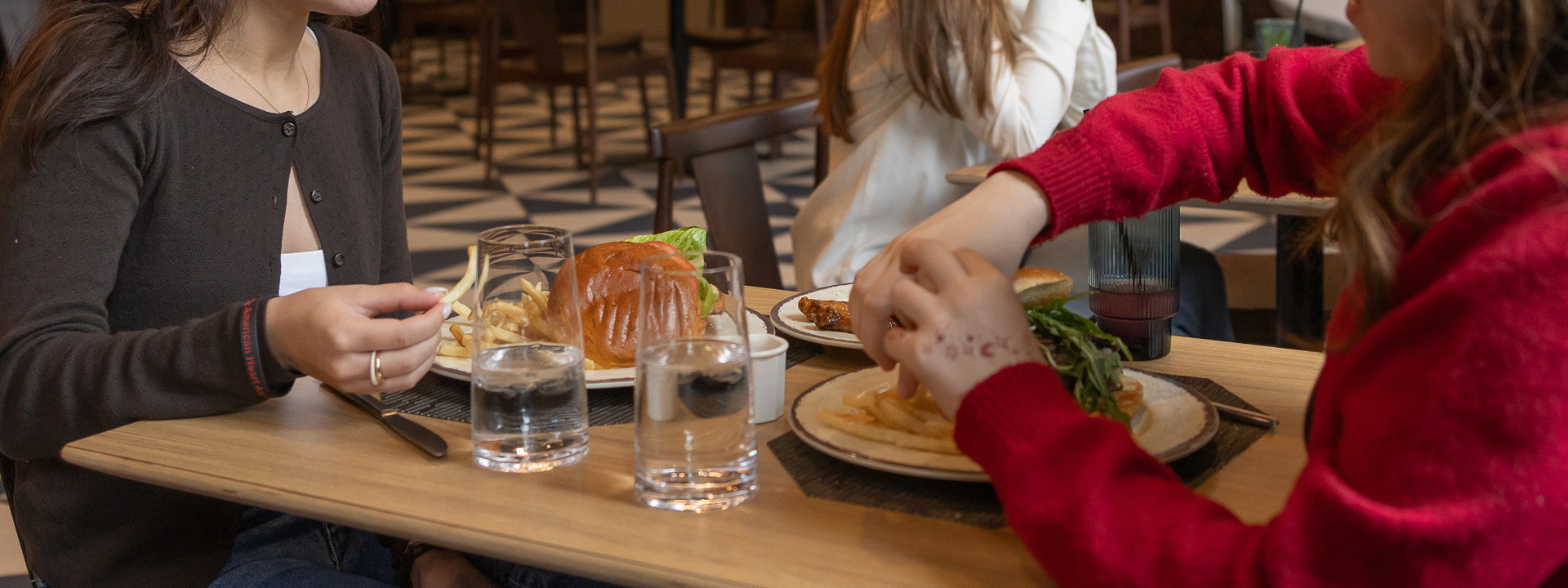 Friends enjoying lunch at The Pub